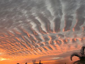 A radiant sunset over a peaceful horizon, symbolising reflection, spiritual awareness, and the universal law of creating tomorrow through today’s actions.